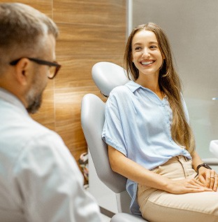 Lady smiles at dentist