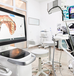 dental office with technology displaying model of patients teeth