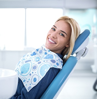 Smiling woman sitting in dental office