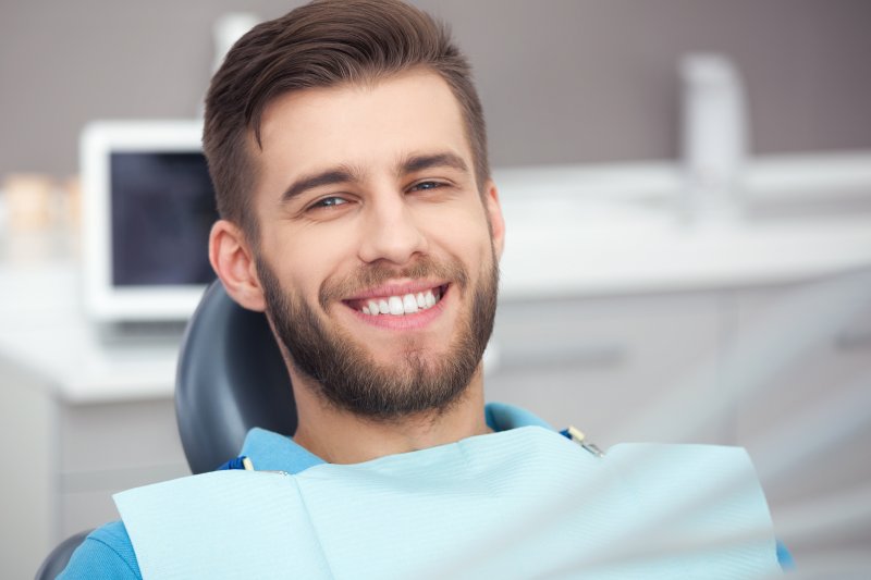 patient smiling after getting veneers